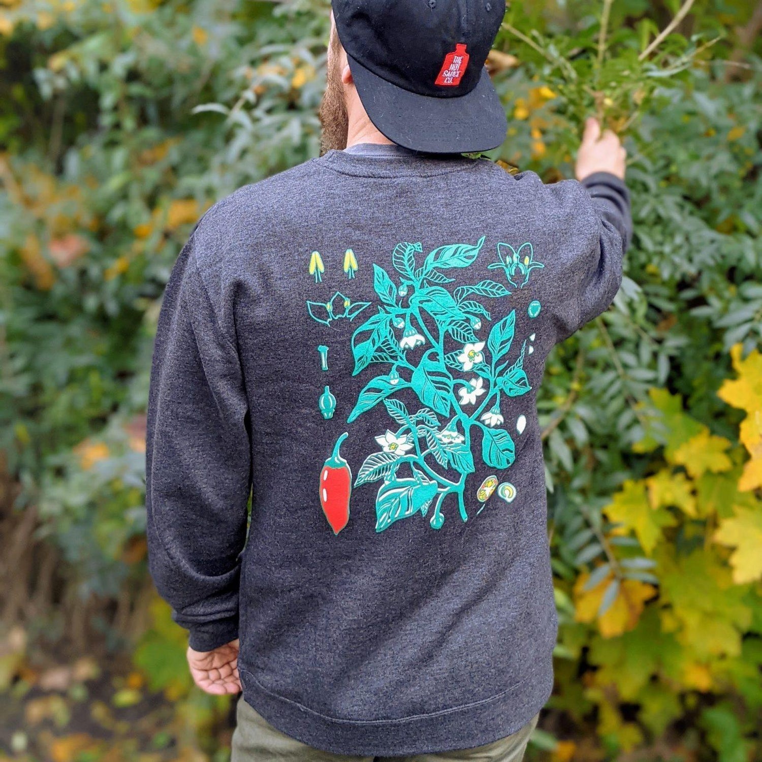 Capsaicin Crewneck in the Garden: Vibrant and Stylish Clothing for Hot Sauce Enthusiasts | Fresh Comfy Sweater